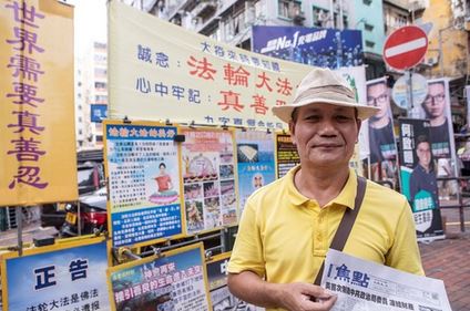 Image for article Hong Kong: Il sostegno del pubblico contribuisce all'arresto di una persona che ha danneggiato lo striscione dei praticanti